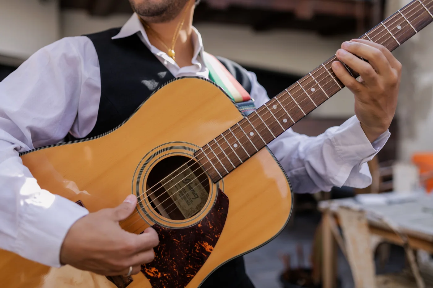 A flamenco guitarist playing on stage